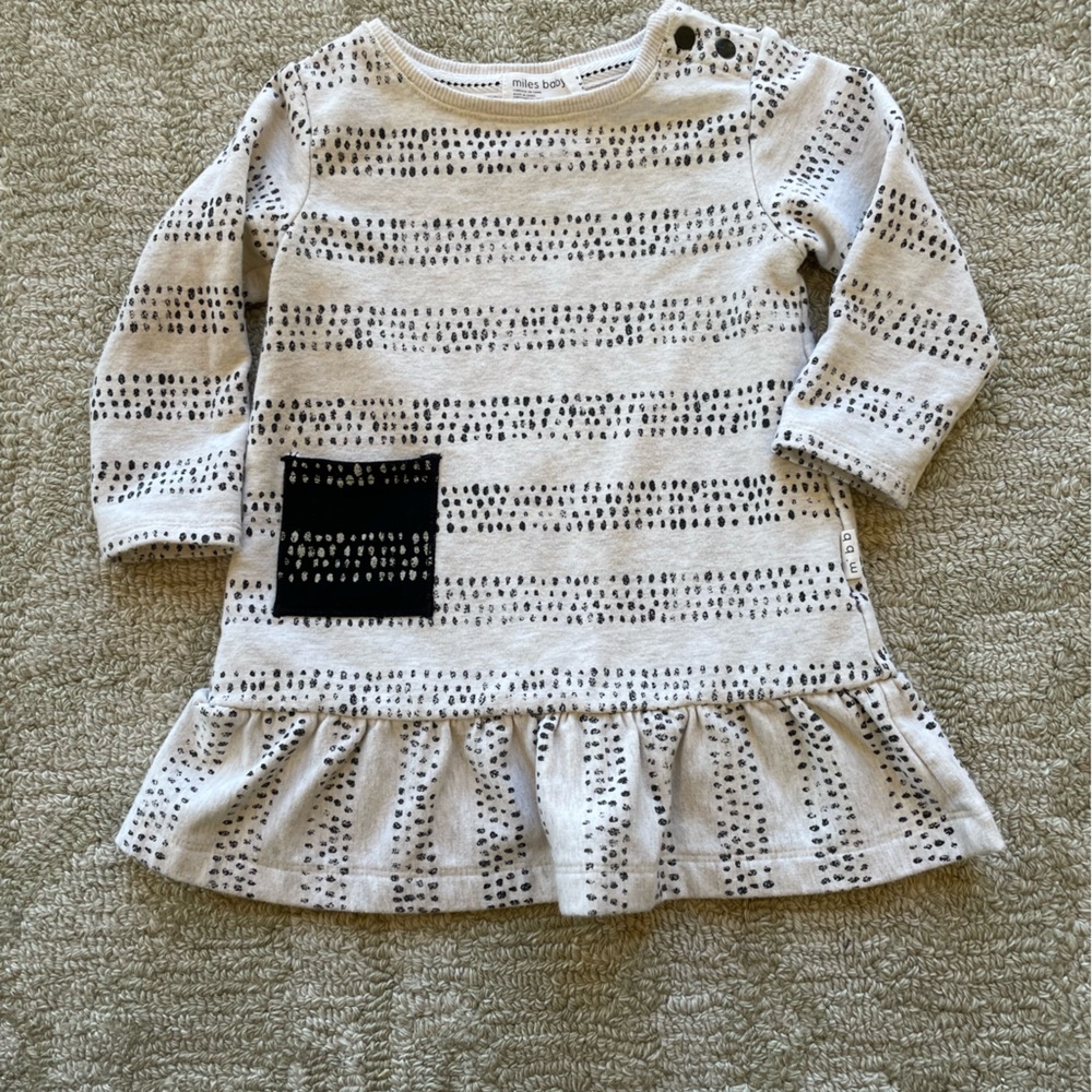 Miles baby cream and black dress